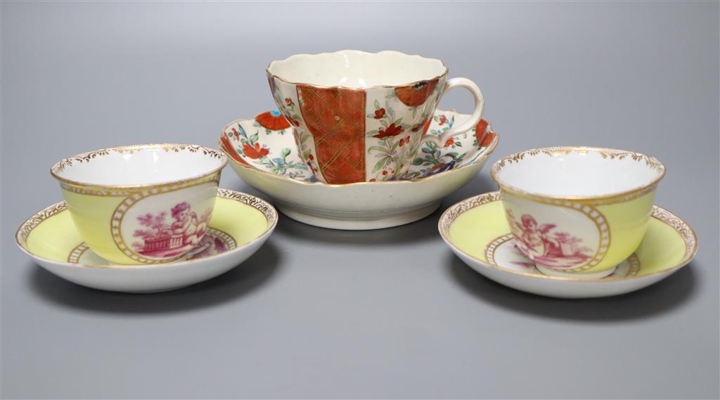 A Worcester cup and saucer, late 18th century, and a pair of Meissen outside printed coffee cups and saucers, largest saucer diameter 1